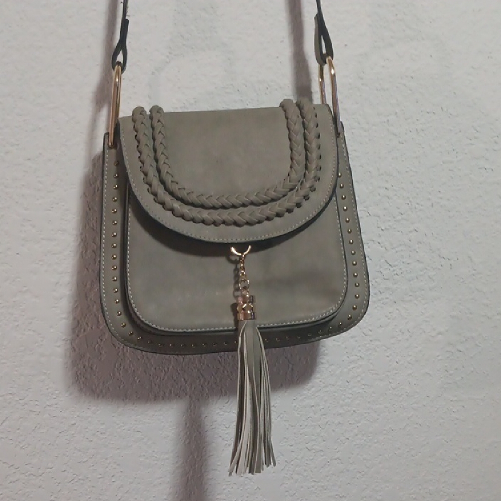 Gray Crossbody Bag with Tassel Accents and Gold Hardware